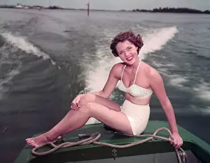Beauty Pageant Winner Riding on Boat