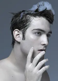 Reflective Prints: Beauty portrait of a young man washing his hair