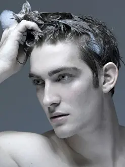 Thoughtful Prints: Beauty portrait of a young man washing his hair