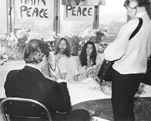 Prints of AMSTERDAM - March 25: Beatles singer, songwriter and guitarist John Lennon and his wife of a week Yoko Ono receive the press at their bedside in the Presidential Suite of the Hilton Hotel The Beatles Through the Lens: Bed In For Peace