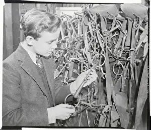 Ben Cooper Examining Bit in Equestrian Shop