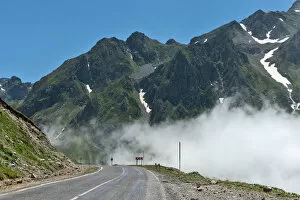 Images Dated 1st July 2013: bend, clear sky, color image, curve, day, fog, landscape, mist, mountain, mountain range