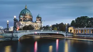 Berlin Cathedral on the Spree River with passing excursion steamer, light traces, dusk, Berlin, Germany