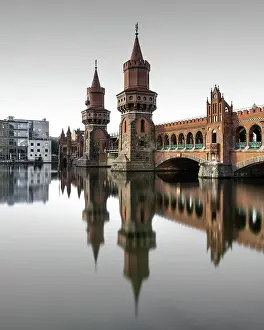 Berlin Oberbaum Bridge at Warschauer Strasse in Berlin with reflection in the Spree, Berlin, Germany