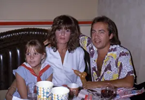 Bernie Taupin at a Restaurant with Wife and Muse