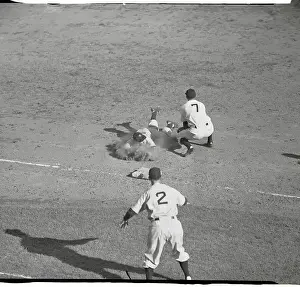 Berra Sliding into Third Base