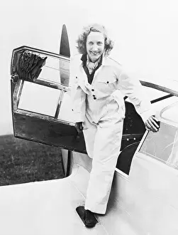 Beryl Markham Standing on the Wing of a Small Plane