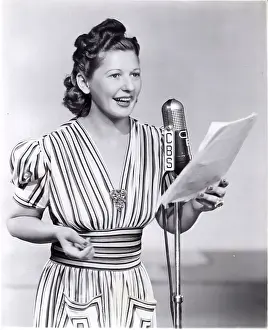 Logo Prints: Bess Johnsonin Front Of Microphone
