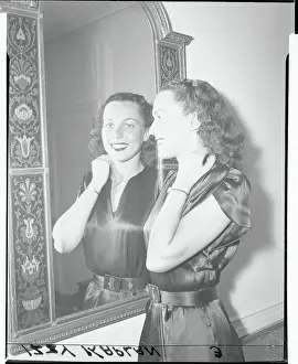 Bess Myerson Smiling at Reflection