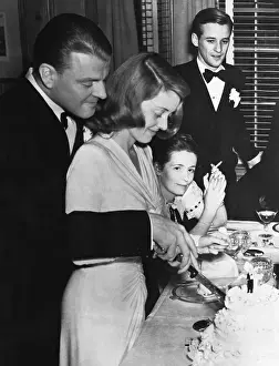 Bette Davis and Arthur Farnsworth Cutting Wedding Cake