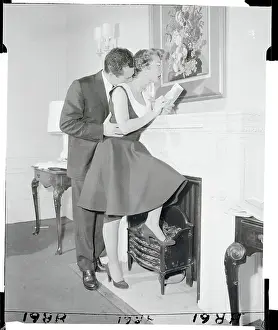 Intimacy Prints: Betty Garrett and Husband Cuddling at Fireplace