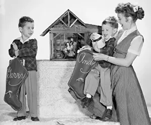 Betty Garrett and Her Sons Preparing Christmas Stockings