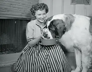 Betty White Feeding Her Dog