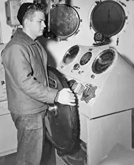 Norfolk Prints: Bevin E. Travis Standing at Ship Wheel