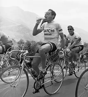 Bicyclist In Race Drinks From Bottle