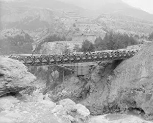 Bicyclists Crossing Bridge