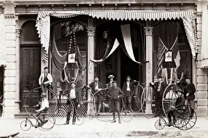 Bicyclist Prints: Bicyclists Posed In Front Of Draped Buil