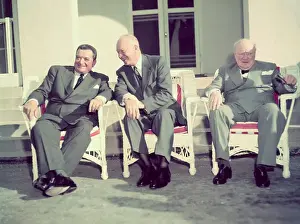 The Big Three Members Sitting in Lounge Chairs