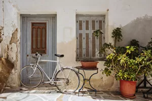 Images Dated 31st August 2012: Bike near old house in Naxos town, Naxos, Greece