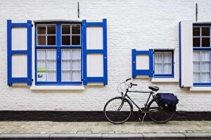 Bike parked near house in Bruges, Belgium