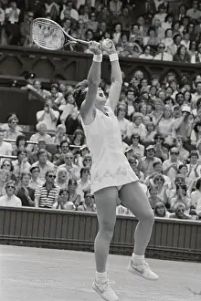 Billie Jean King Raising Her Arms in Victory After Tennis Match