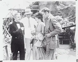 Billie De Vaull Showing a Program to Marion Davies
