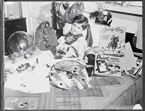 Billy Bente Sitting Surrounded by Toys