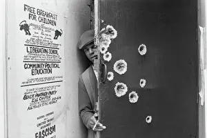 Black Power Prints: Black Panther Standing Behind Bullet-Riddled Door