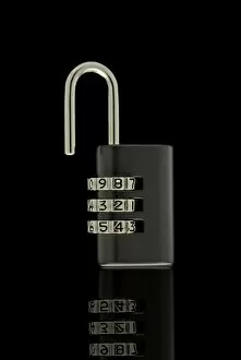 Opened Gallery: Black unlocked combination lock on black