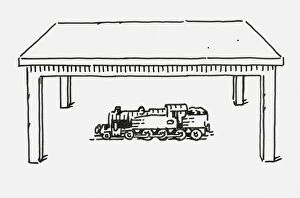 Images Dated 14th July 2009: Black and white digital illustration of toy steam train below table