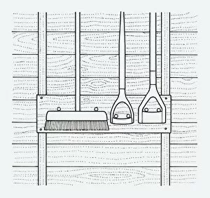 Black and white illustration of broom and hoes hanging on tool rack in shed