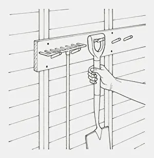 Spade Prints: Black and white illustration of hand hanging garden spade next to rake on hooks in a shed