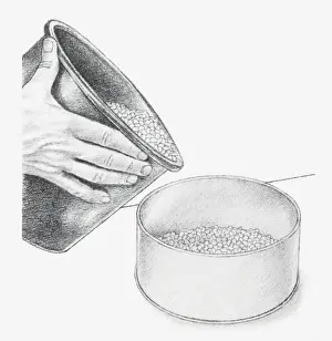 Preserving Prints: Black and white illustration of hand holding bucket of blue silica gel crystals and pouring into base of biscuit tin