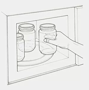 Images Dated 19th January 2010: Black and white illustration of hand placing glass jars into microwave to sterilise them
