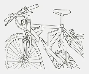 Resourceful Prints: Black and white illustration of hands hanging a bicycle on a pair of brackets on a wall