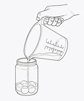 Ball Prints: Black and white illustration of pouring water on putty balls in jar