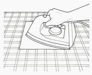 Resourceful Prints: Black and white illustration of removing candle wax from tablecloth using warm iron and kitchen pape