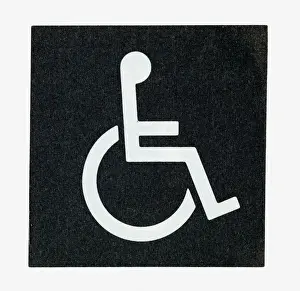Disability Prints: Black and white illustration of white silhouette of man in wheelchair