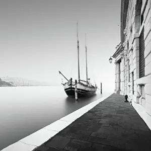 Discover Imagery That Inspires: Black and white photograph of the Fondamenta Salute in the fog with a historic sailing ship in Venice