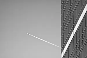 Black and White Skyscraper With Vapor Trail