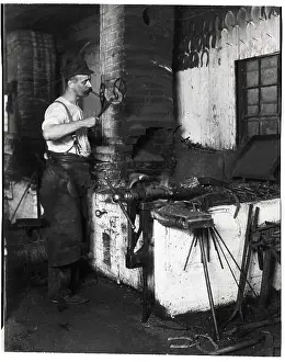 Horseshoe Prints: Blacksmith Lights Cigar W/Hot Horseshoe