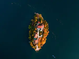 Bled Lake with Pilgrimage Church of the Assumption of Maria at sunrise. Aerial view