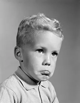Human Face Gallery: Blonde boy pouting, sticking out his lower lip, ready to cry
