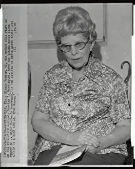 Blonde Fowler Sitting with Booklet in her Lap