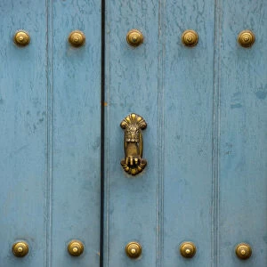 Images Dated 5th April 2011: A Blue Door With Brass Decorative Knobs