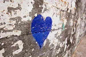 Blue heart painted on a wall