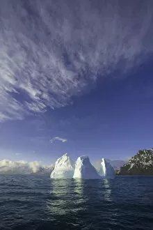 Iceberg Ice Formation Gallery: Blue iceberg floating in sea in spring