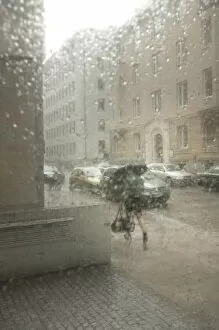 Raindrop Gallery: Blurred street atmosphere through a window pane with rain drops