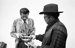 Prints of NEW YORK - MAY 6: Guitarists Bo Diddley and Chuck Berry (on the left) relax backstage at Madison Square Garden in the concert movie ´Let the Good Times Roll´ on May 6, 1972 in New York City Bo Diddley: Rhythm & Riffs Prints: Bo Diddley & Chuck Berry Let The Good Times Roll