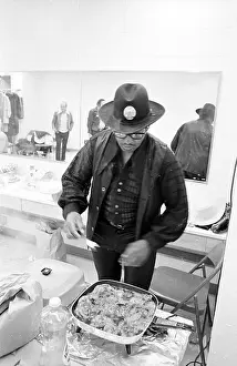Prints of NEW YORK - MAY 6: Guitarist Bo Diddley digs in to some fried chicken backstage at Madison Square Garden in the concert movie Let the Good Times Roll on May 6, 1972 in New York City, New York Bo Diddley: Rhythm & Riffs Prints: Bo Diddley & Chuck Berry Let The Good Times Roll